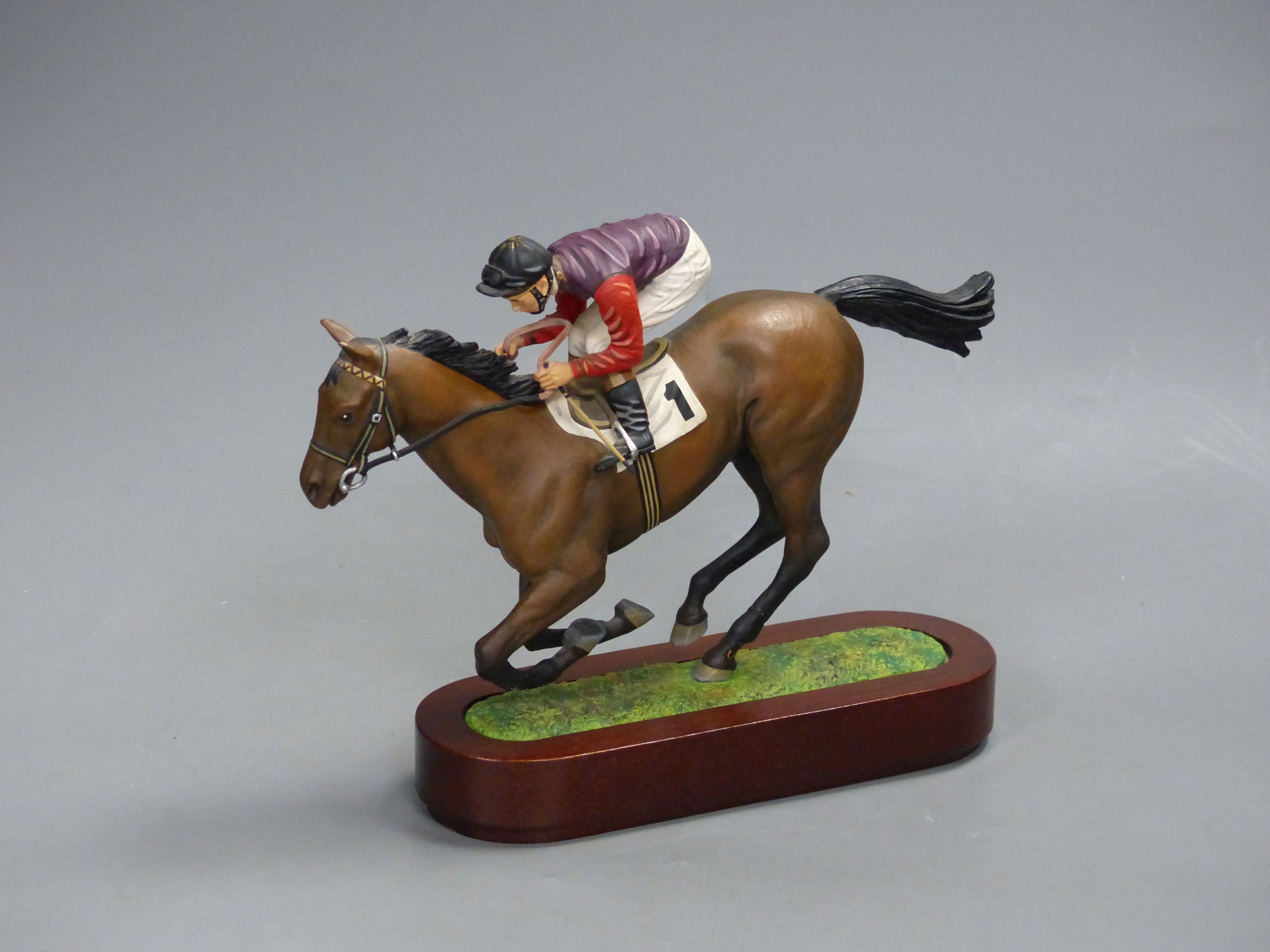 A Cameron Sculptures cold-painted bronze model of a racehorse with jockey up, height 16.5cm
